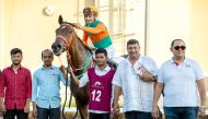 The connection of Al Shomos celebrate after the Mubarak bin Saeed Aljafai Al Naimi-owned mare won the Local Thoroughbred Trophy at Al Uqda Racecourse yesterday.  Pictures: Juhaim/QREC
