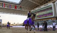 Egypt’s Karim Elzoghby astride Zandigo celebrates after finishing the jump off.   