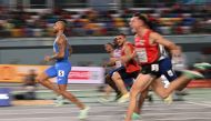 Italy's Lamont Marcell Jacobs (left) runs ahead of the field as he competes in the semi-finals of the men's 60 metres during The European Indoor Athletics Championships at The Atakoy Athletics Arena in Istanbul on March 4, 2023. (Photo by OZAN KOSE / AFP)
 