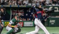 Japan's Shohei Ohtani hits a three-run home run during the World Baseball Classic (WBC) Pool B round game between Japan and Australia at the Tokyo Dome in Tokyo on March 12, 2023. (Photo by Yuichi YAMAZAKI / AFP)