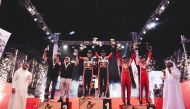 Qatar Motor and Motorcycle Federation (QMMF) President Abdulrahman Al Mannai and QMMF Executive Director Amro Al Hamad with the podium winners of the Qatar International Baja. Qatar’s Nasser Saleh Al Attiyah and co-driver Mathieu Baumel won the car category in their Toyota GR DKR Hilux.