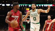 Jimmy Butler #22 of the Miami Heat is defended by Jayson Tatum #0 of the Boston Celtics during the third quarter of game one of the Eastern Conference Finals at TD Garden on May 17, 2023 in Boston, Massachusetts.  Photo by Adam Glanzman / AFP