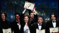 British director Jonathan Glazer, South Korean actor Song Kang-ho Japanese, French director Justine Triet, Japanese director Kore-eda Hirokazu and Japanese actor Koji Yakusho pose on stage during the closing ceremony of the 76th edition of the Cannes Film Festival in Cannes, southern France, on May 27, 2023.