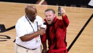 Conor McGregor is seen on the court during a timeout in Game Four of the 2023 NBA Finals between the Denver Nuggets and the Miami Heat at Kaseya Center on June 09, 2023 in Miami, Florida. (Photo by Megan Briggs / GETTY IMAGES NORTH AMERICA / Getty Images via AFP)