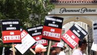 Striking WGA (Writers Guild of America) workers picket outside Paramount Studios on July 12, 2023 in Los Angeles, California. Photo by MARIO TAMA / GETTY IMAGES NORTH AMERICA / Getty Images via AFP