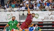 A Qatari player attempts to score during final against Saudi Arabia.