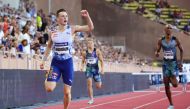 Karsten Warholm of Norway (L) crosses the finish line ahead of Alison Dos Santos of Brazil (R) in the Men's 400m Hurdles event in Monaco, on July 21, 2023. (Photo by Clement Mahoudeau / AFP)