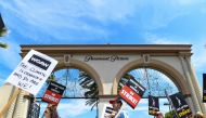 Members of the Writers Guild of America and the Screen Actors Guild walk a picket line outside of Paramount Pictures, in Los Angeles, California, on July 21, 2023. (Photo by VALERIE MACON / AFP)
