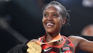 First-placed Kenya's Faith Kipyegon celebrates with her gold medal after winning the women's 1500m final during the World Athletics Championships at the National Athletics Centre in Budapest on August 22, 2023. (Photo by Kirill KUDRYAVTSEV / AFP)
