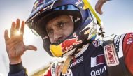 Al Attiyah gestures after finishing the stage.   