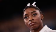 USA's Simone Biles reacts during the artistic gymnastics women's team final during the Tokyo 2020 Olympic Games at the Ariake Gymnastics Centre in Tokyo on July 27, 2021. Photo by Loic VENANCE / AFP