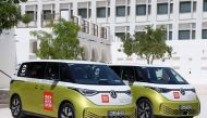 Volkswagen ID. Buzz vehicles are parked outside the venue hosting the Geneve International Motor Show (GIMS) in Doha on October 1, 2023, after crossing through 12 countries to arrive in Qatar from Geneva. Photos by KARIM JAAFAR / AFP