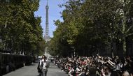 Models present creations by British designer Stella McCartney during her show next to the eiffel tower as part of the Womenswear Spring/Summer 2024 Paris Fashion Week in Paris on October 1, 2023. (Photo by Julien De Rosa / AFP)