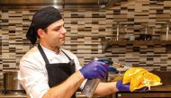 A chef in action at the Wyndham Grand Doha West Bay Beach.