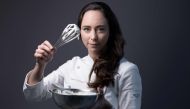 A picture taken on November 6, 2023 shows French World pastry champion Nina Metayer posing at her workshop in Issy-Les-Moulineaux, outside Paris. (Photo by Joel Saget / AFP)