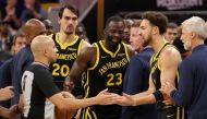 Klay Thompson #11 and Draymond Green #23 of the Golden State Warriors complain to the referee after getting into an altercation with the Minnesota Timberwolves at Chase Center on November 14, 2023 in San Francisco, California. (Photo by EZRA SHAW / GETTY IMAGES NORTH AMERICA / Getty Images via AFP)
