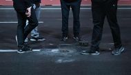 Race Operations officials inspect a loose drain cover on the track during the first practice session for the Las Vegas Formula One Grand Prix on November 16, 2023, in Las Vegas, Nevada. Photo by Jim WATSON / AFP