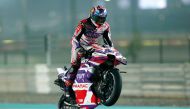 Prima Pramac Racing's Spanish rider Jorge Martin does a wheelie as he wins the sprint race ahead of the Qatar Airways Grand Prix of Qatar at the Lusail International Circuit, yesterday. Pictures: Rajan Vadakkemuriyil