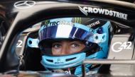 Mercedes' British driver George Russell sits in his car during the third practice session for the Abu Dhabi Formula One Grand Prix at the Yas Marina Circuit in the Emirati city on November 25, 2023. (Photo by Giuseppe Cacace / AFP)