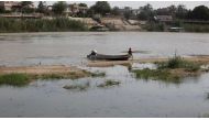 File photo: A boy sits in a boat in Tigris River in Baghdad, Iraq June 4, 2018. (Reuters)