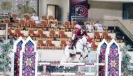 Mohammed Dhafi Al Marri guides Destiny 297 over a fence during the Small Tour event.