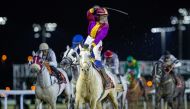 Abdulla Rashid Al Hajri celebrates after steering Safi Al Zaman to victory. PICS: Juhaim/QREC  