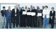 A group photo of the winning team in QU Business Challenge with officials.