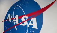 The NASA logo is displayed at the Earth Information Center exhibit, at NASA headquarters in Washington, DC, on June 21, 2023. Photo by Stefani REYNOLDS / AFP