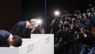 Toyota Industries President Koichi Ito (2nd L) and others bow their heads at the beginning of a press conference in Tokyo on January 29, 2024. Photo by JIJI Press / AFP