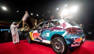 QMMF President Abdulrahman Al Mannai flags off Nasser Saleh Al Attiyah's car during the ceremonial start of the Qatar International Rally. 