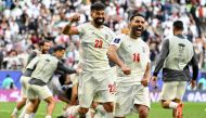 Iran's players celebrate their team's second goal during the Qatar 2023 AFC Asian Cup quarter-final football match between Iran and Japan at Education City Stadium in al-Rayyan, west of Doha, on February 3, 2024. (Photo by HECTOR RETAMAL / AFP)
