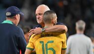 Australia’s coach Graham Arnold consoles Australia’s defender Aziz Behich after the Asian Cup quarter-final.