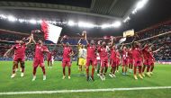 Qatar players celebrate after qualifying for the semi-final on Saturday.