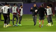 Qatar coach Marquez Lopez speaks to his players during a training session ahead of the semi-final against Iran. Photo by: Mohammed Faraj/The Peninsula 