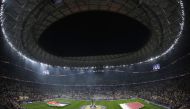 Jordan and Qatar's starting eleven stand up for the national anthems before the start of the Qatar 2023 AFC Asian Cup final football match between Jordan and Qatar at the Lusail Stadium in Lusail, north of Doha on February 10, 2024. Photo by KARIM JAAFAR / AFP
