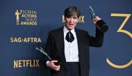 Irish actor Cillian Murphy poses in the press room with the awards at the Shrine Auditorium in Los Angeles, February 24, 2024. (Photo by Robyn Beck / AFP)