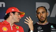 Ferrari’s Carlos Sainz Jr speaks with Mercedes’ Lewis Hamilton (right) at a press conference. AFP