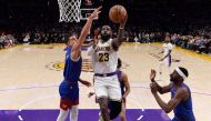 Lebron James of the Los Angeles Lakers scores his 40,000th career point during the first half against Michael Porter Jr of the Denver Nuggets at Crypto.com Arena on March 2, 2024 in Los Angeles, California. (Photo by Kevork Djansezian/Getty Images/AFP) 