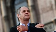 Former Ferrari pilot Austrian Gerhard Berger watches F1 fans gathered in Piazza Duomo in Milan on September 4, 2019 during the presentation of cars and drivers for 90th anniversary of the founding of Scuderia Ferrari. Photo by Miguel MEDINA / AFP