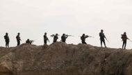 Iraqi forces take part in an anti-ISIS group operation, launched by Iraqi security forces, in al-Miqdadiyah in Iraq's Diyala province on March 10, 2024. (Photo by Younis AL-BAYATI / AFP)