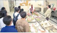 Dr. Avelin Malyango, Assistant Professor of Anatomy in Radiology and Assistant Dean for Medical Student Affairs, with participating high school students during an anatomy lab activity.