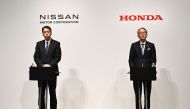 Makoto Uchida, president and CEO of Nissan (L) and Toshihiro Mibe, Honda director, president and representative executive officer attend a joint press conference in Tokyo on March 15, 2025. Photo by Philip FONG / AFP