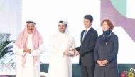  Minister of Municipality H E Abdullah bin Hamad bin Abdullah Al handing over the award to Italian Ambassador to Qatar H E Paolo Toschi.