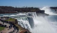 People visit Niagara Falls on the day ahead of the eclipse on April 7, 2024, in Niagara Falls, New York. Adam Gray/Getty Images/AFP 