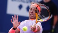Spain's Rafael Nadal returns the ball to Italy's Flavio Cobolli during the ATP Barcelona Open 