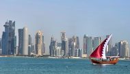 A dhow donning a Qatari flag sails smoothly on calm waters along the Corniche. According to QMD, the weather this weekend (April 19-20) will be relatively hot. (Photo by Marivie Alabanza / The Peninsula) 