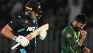 Pakistan's Mohammad Amir celebrates after taking the wicket of New Zealand's Dean Foxcroft (L) during the second Twenty20 international cricket match between Pakistan and New Zealand at the Rawalpindi Cricket Stadium in Rawalpindi on April 20, 2024. (Photo by Aamir QURESHI / AFP)
