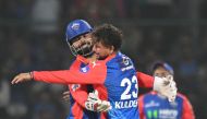 Delhi Capitals' Kuldeep Yadav (R) celebrates with captain Rishabh Pant after taking the wicket of Gujarat Titans' Rahul Tewatia during the Indian Premier League (IPL) Twenty20 cricket match between Delhi Capitals and Gujarat Titans at the Arun Jaitley Stadium in New Delhi on April 24, 2024. (Photo by Money SHARMA / AFP)
