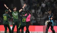 Pakistan's Shaheen Shah Afridi (2ndL) celebrates with teammates after taking the wicket of New Zealand's Jimmy Neesham (unseen) during the fifth and last Twenty20 international cricket match between Pakistan and New Zealand at the Gaddafi Cricket Stadium in Lahore on April 27, 2024. (Photo by Aamir QURESHI / AFP)
