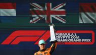 McLaren's British driver Lando Norris celebrates on the podium after winning the 2024 Miami Formula One Grand Prix at Miami International Autodrome in Miami Gardens, Florida, on May 5, 2024. (Photo by Jim WATSON / AFP)
